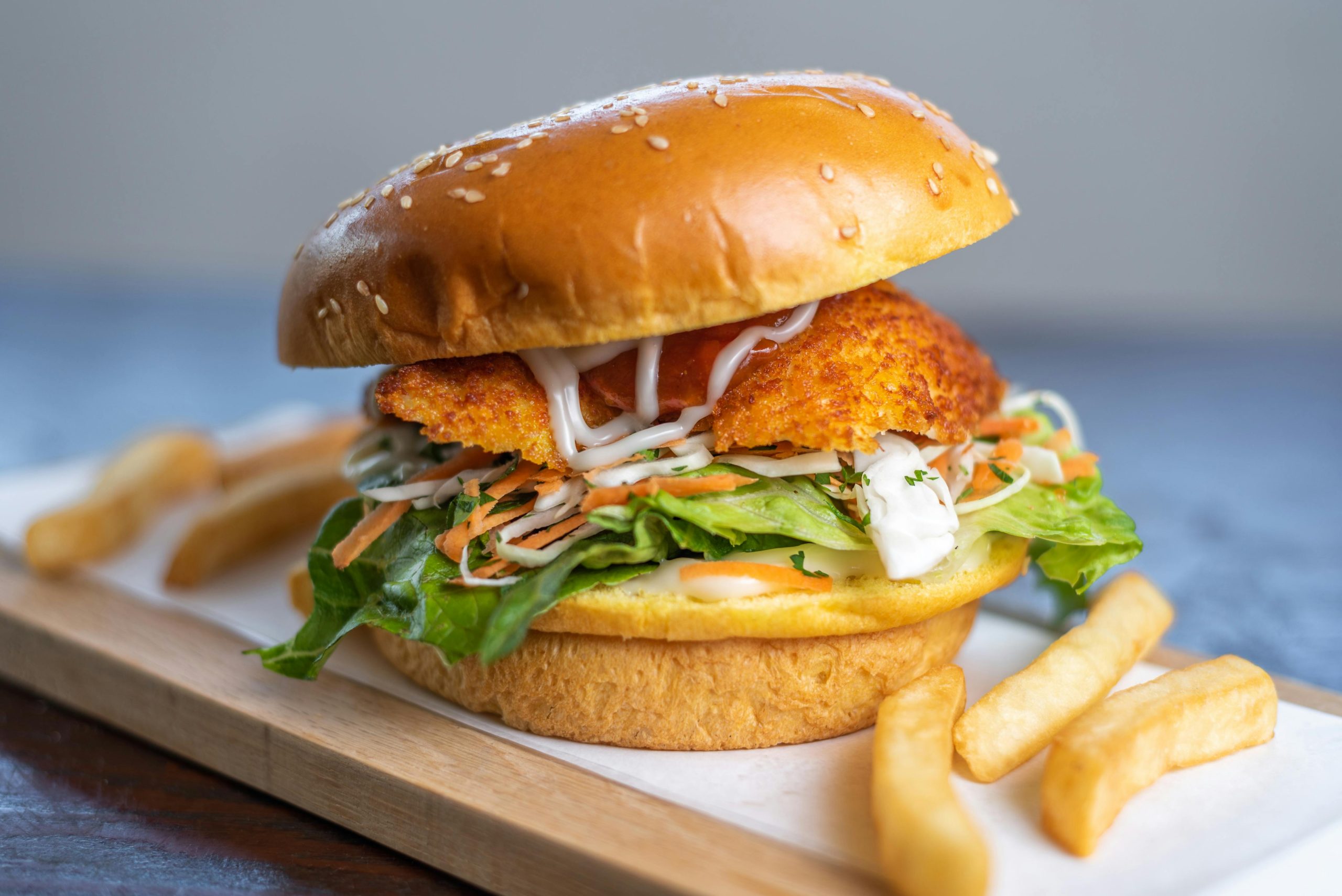 Mouth-watering chicken burger with fries, perfect for lunch in Sydney, Australia.